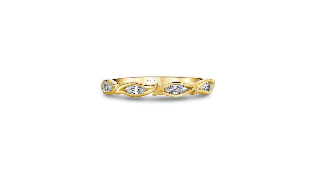 The Tulira “Marquise Leaf” wedding ring in 14-karat yellow gold imitates the shape of leaves and is set with four marquise-cut white diamonds ($2,690). Tulira Marquise Leaf Wedding Band